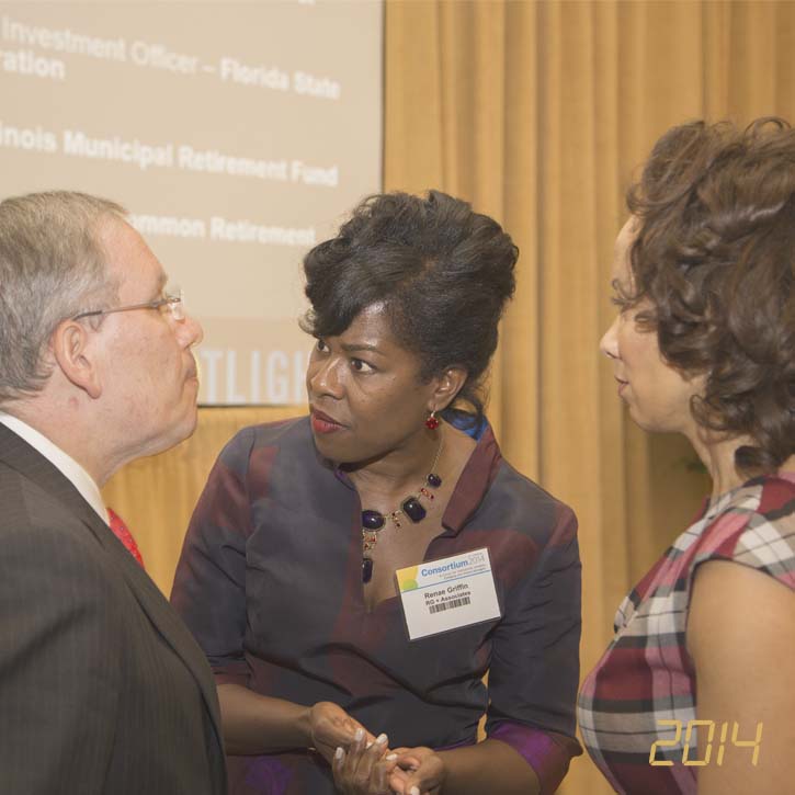 Renae Griffin speaking to a man and woman at Consortium 2014
